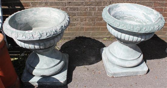 Pair large stone fruited urns on bases